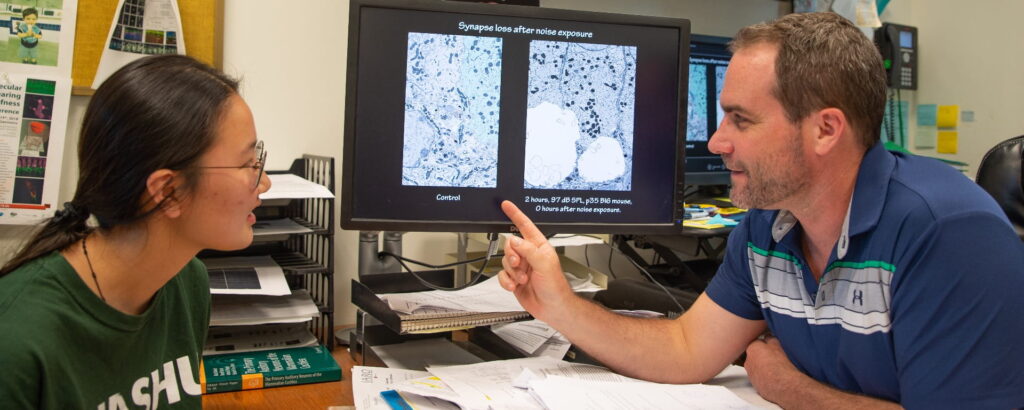 Mark Rutherford and student Heather Chung review TEM photos