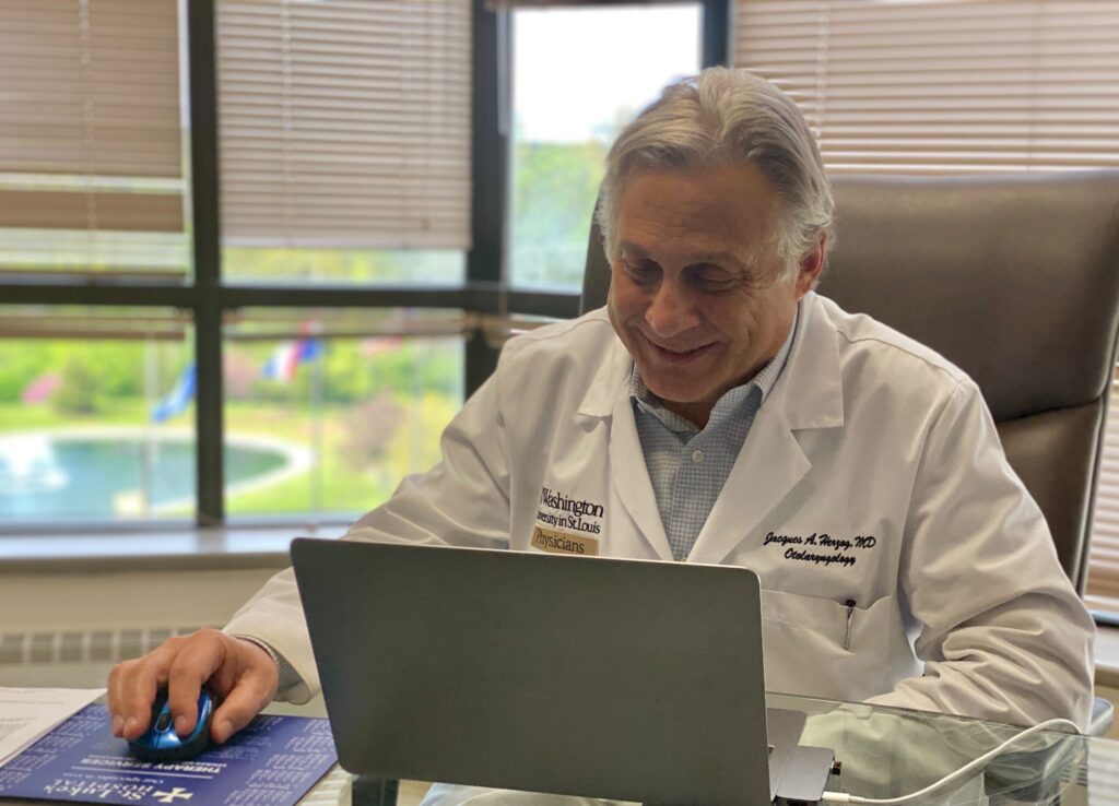 Jacques Herzog, MD, conducting a virtual visit