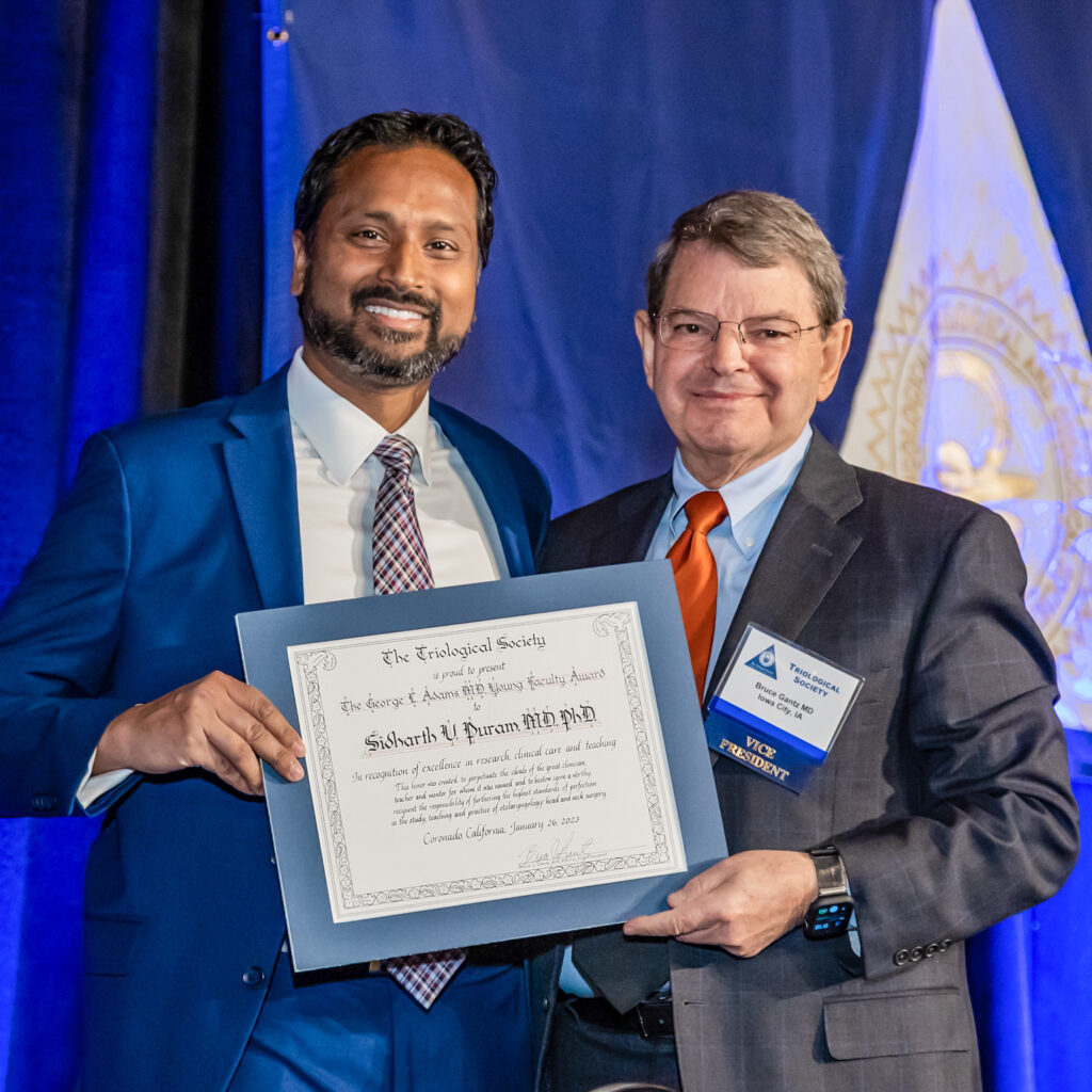 photo of Sid Puram accepting award