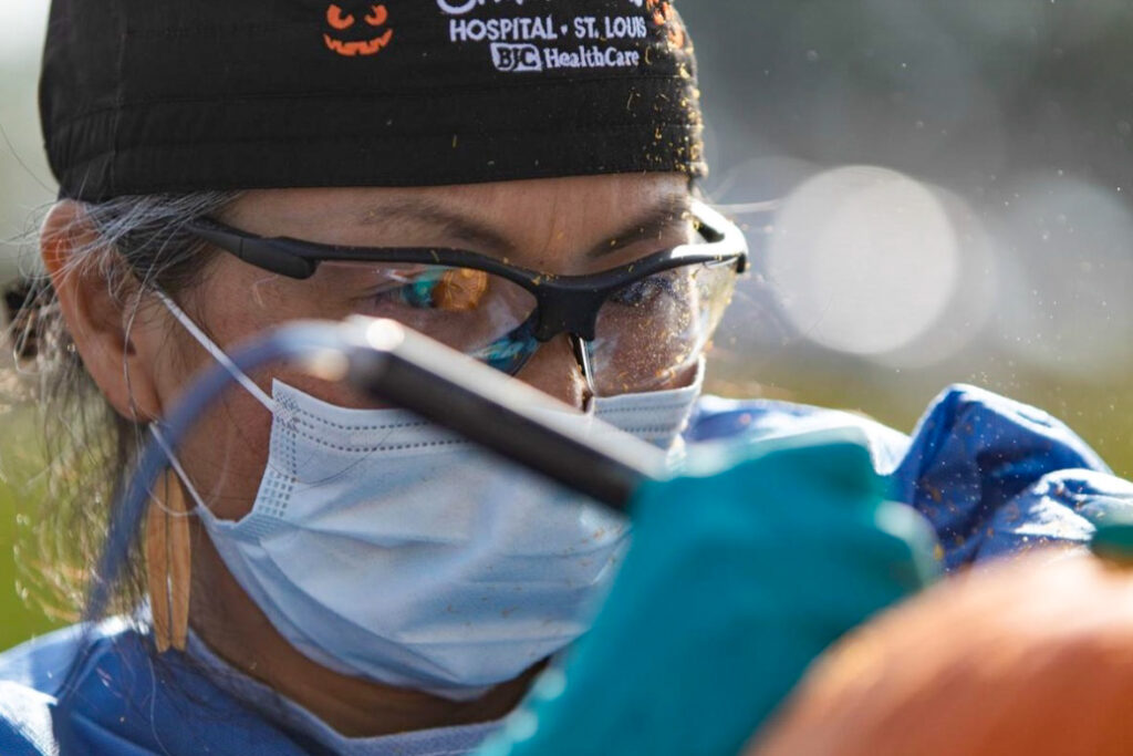 photo of Hirose carving pumpkin