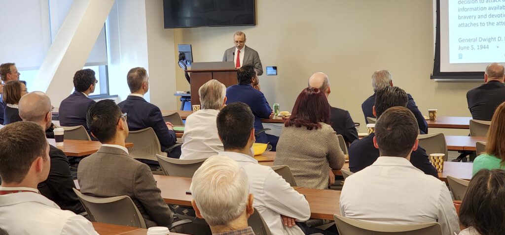 photo of audience listening to speaker Mark Varvares