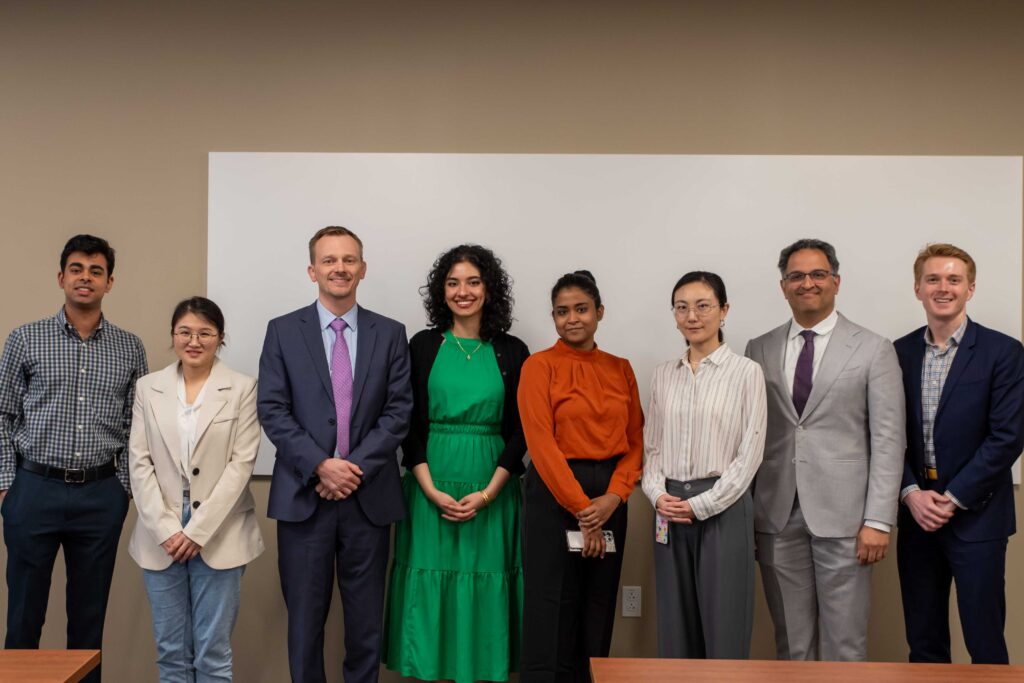 photo of presenters at research symposium