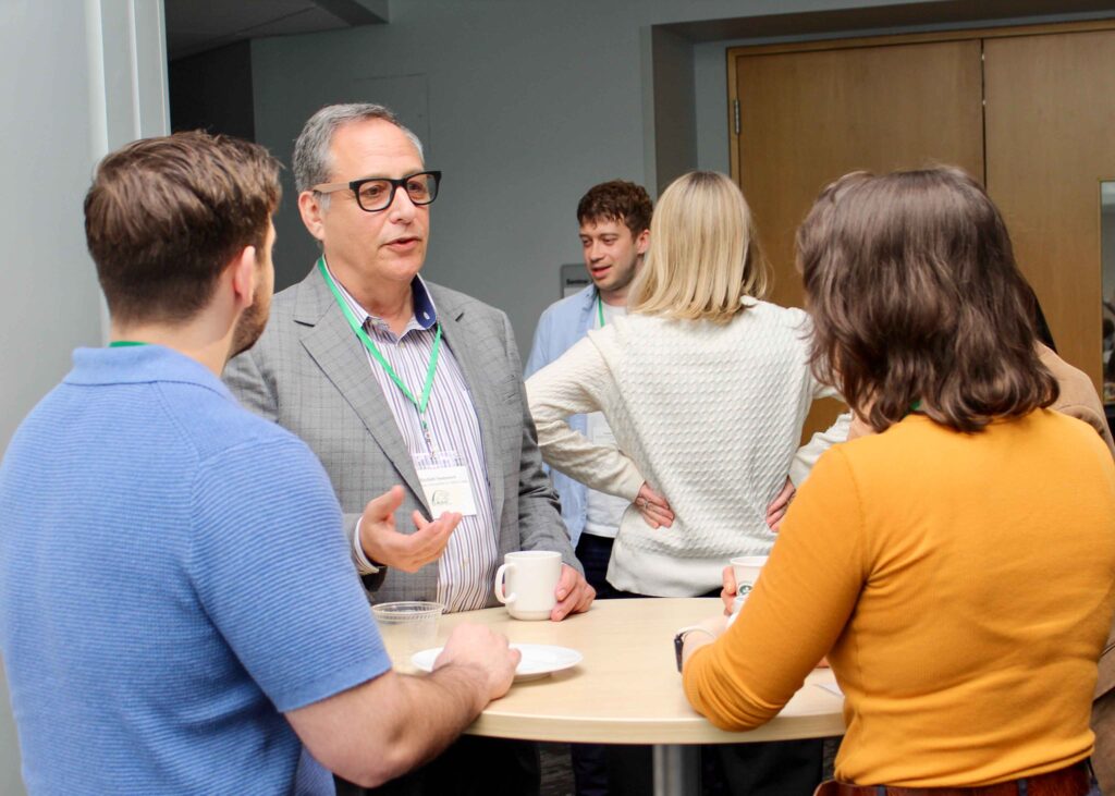 photo of conference participants engaging during a break