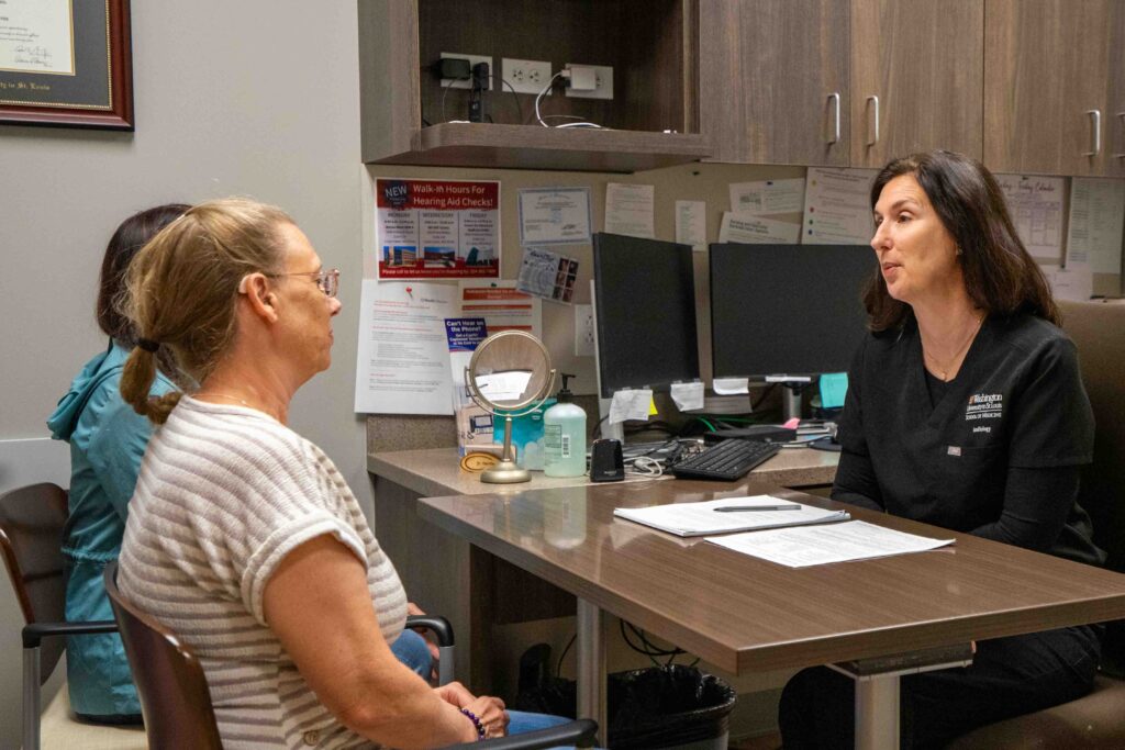 photo of patient and audiologist