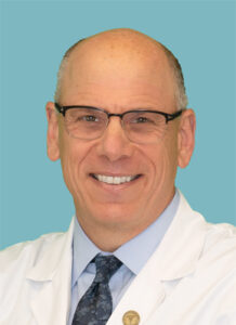 headshot of Craig A. Buchman, MD, FACS