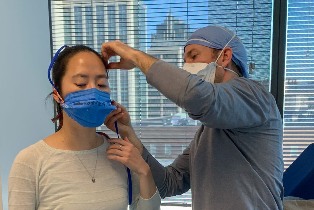 Dr. Bertroche fits medical student with homemade N95 mask