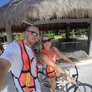Jess and husband biking in Cozumel