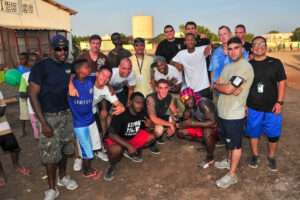 photo of Brown and shipmates at cummunity service project in Africa