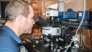 Rutherford at microscope