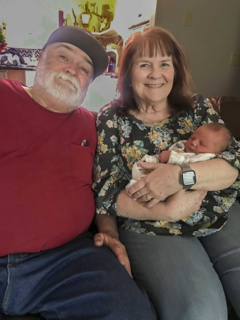 Photo of Petereins with new grandson