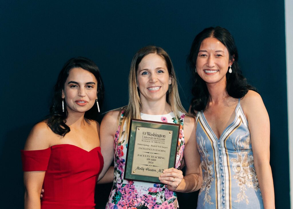 photo of Molly Huston, MD, receiving the faculty teaching award