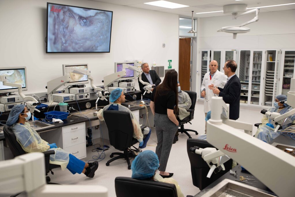 photo of Jay Rubinstein, MD, PhD, addressing residents in surgical simulation lab.